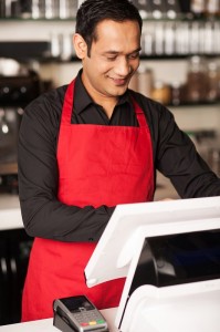 Barista staff placing customers order in queue